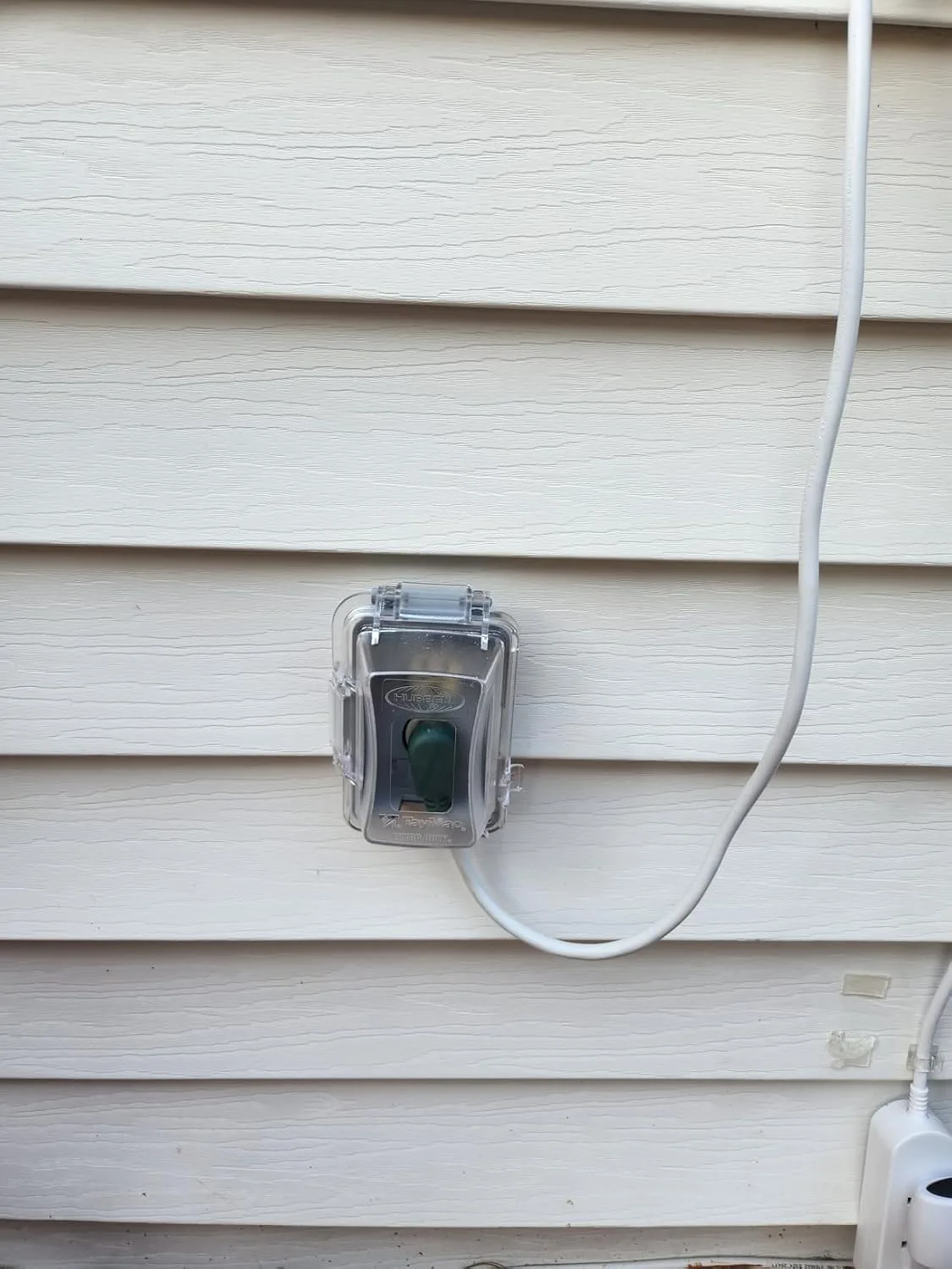 Customer photo of in-use outlet cover installed on outdoor electrical outlet