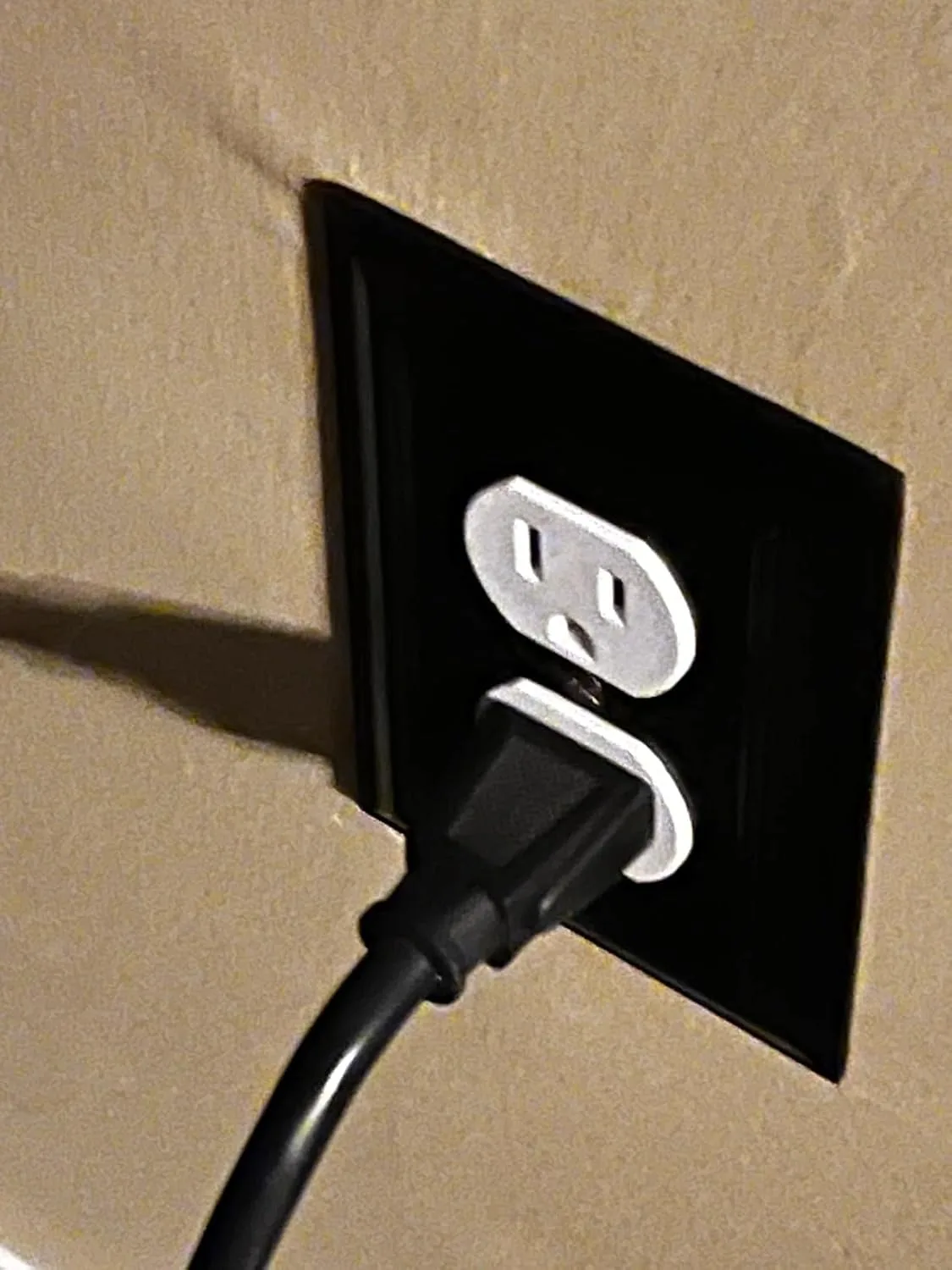 Customer photo of backstab outlet terminals showing failed wire connection