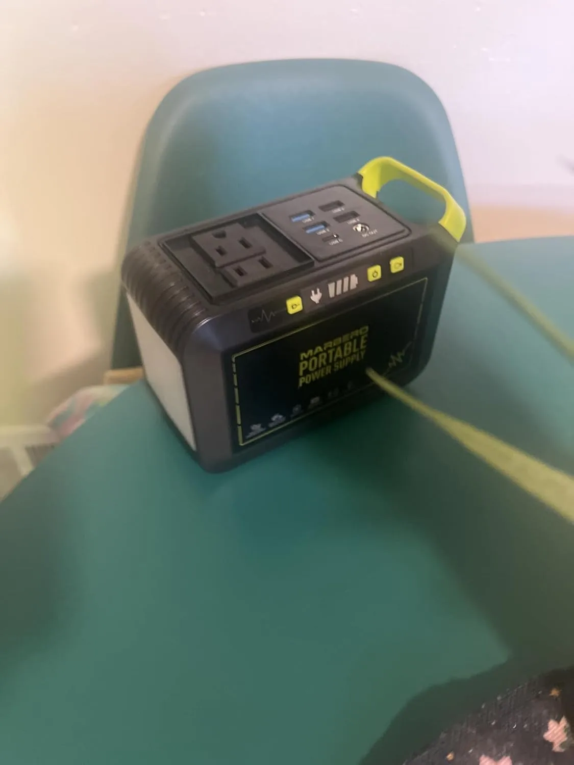 Customer photo of home battery system display showing real-time power usage and charge levels