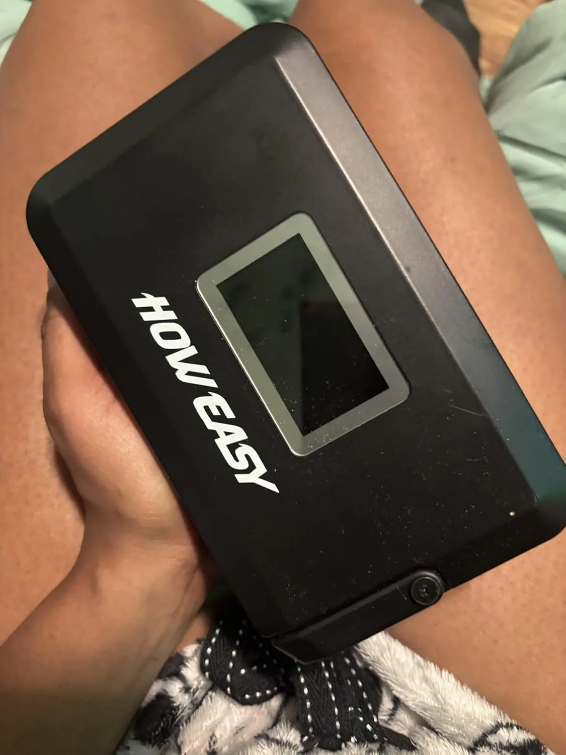 Customer photo of home battery system display showing real-time power output and usage metrics during week-long test