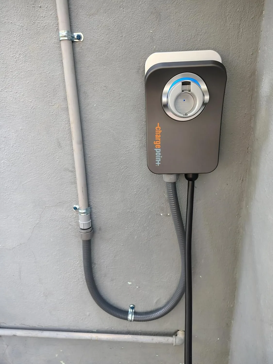 Customer photo of Level 2 EV charger installed on home garage wall