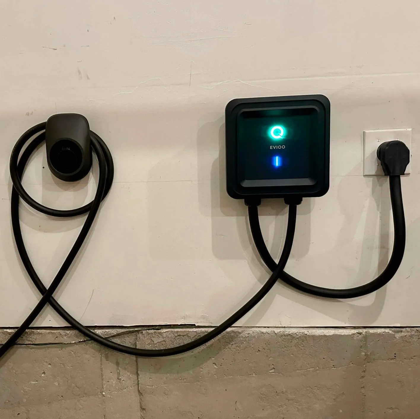 Customer photo of Level 2 EV charger installed on home garage wall