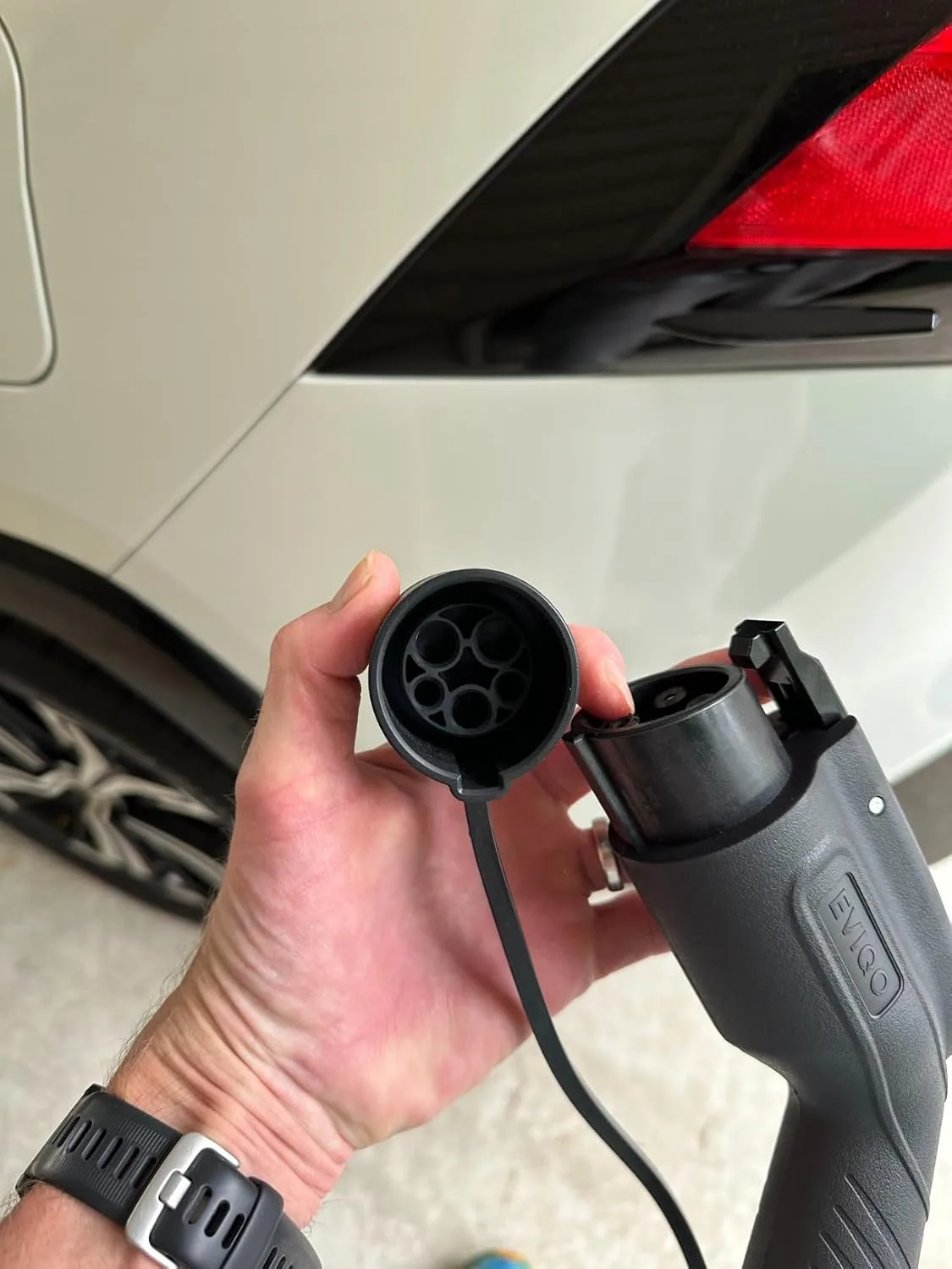Customer photo showing Level 2 EV charger installation with electrical panel and wiring setup